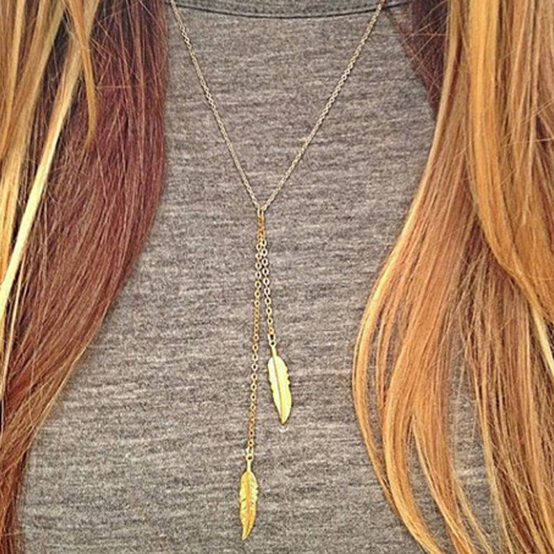 Feather-shaped gold pendant necklace